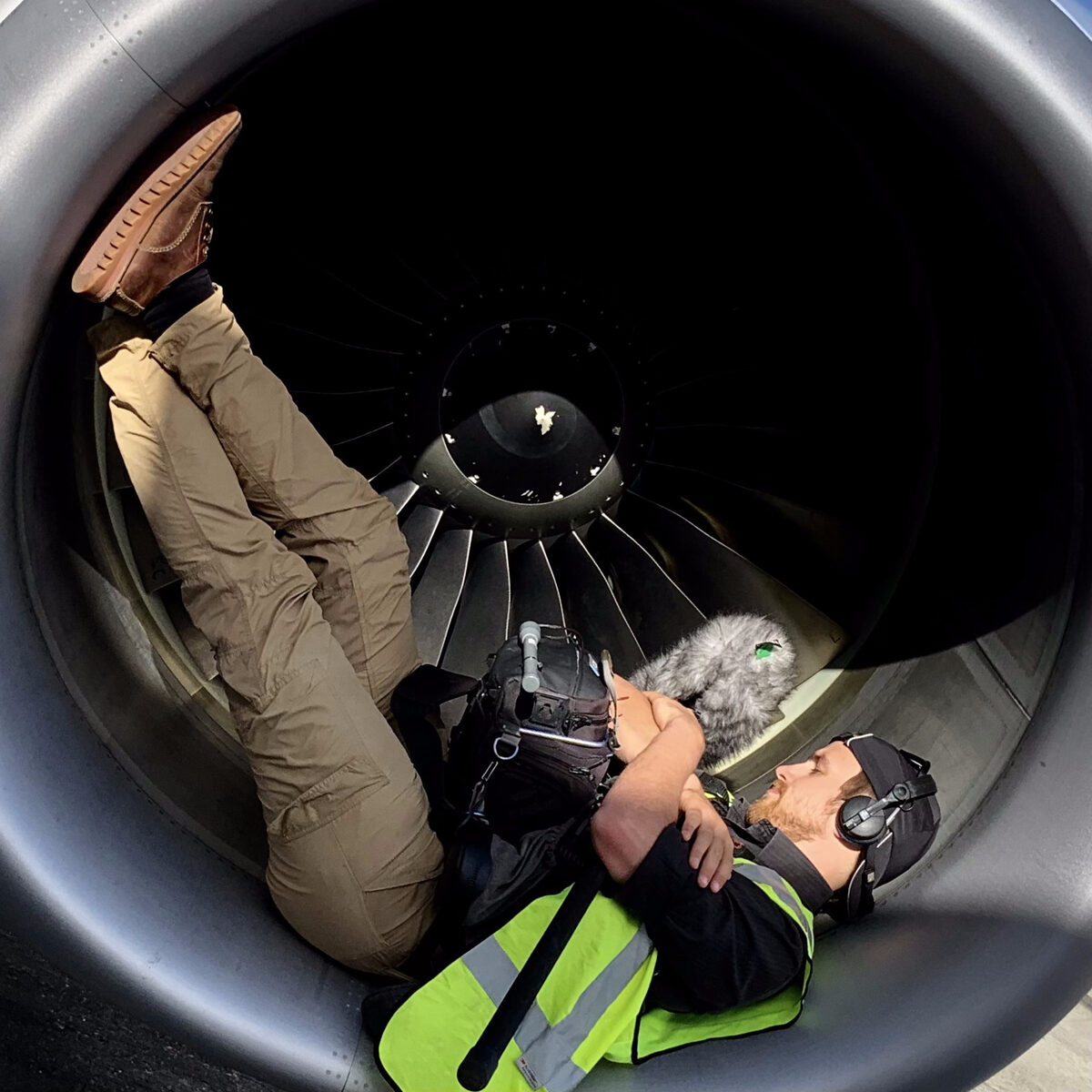 Richard Hubbard recording location sound inside an aircraft engine on location